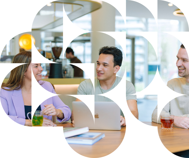 Two professionals discuss security awareness interventions during a meeting in a contemporary office setting.