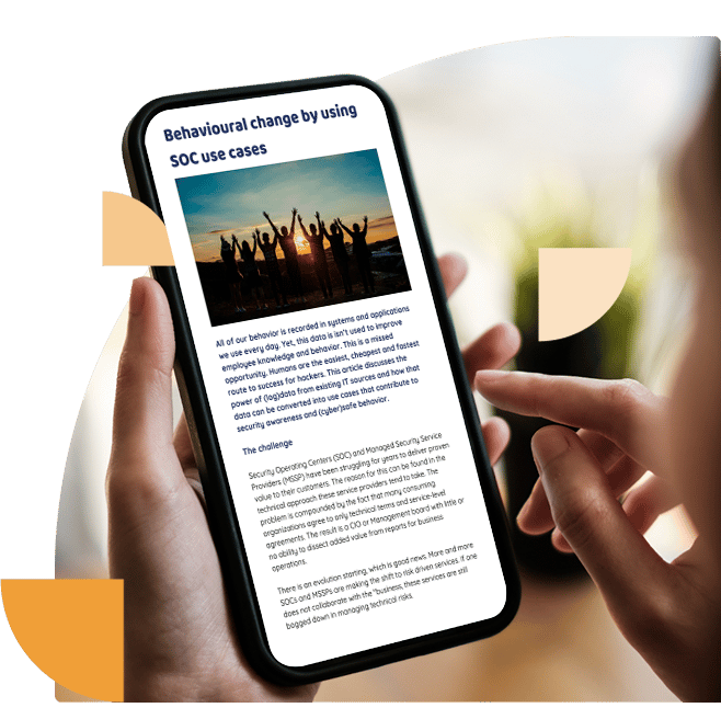 Person holding an iPhone and reading the first page of a whitepaper called “Behavioural change by using SOC use cases”